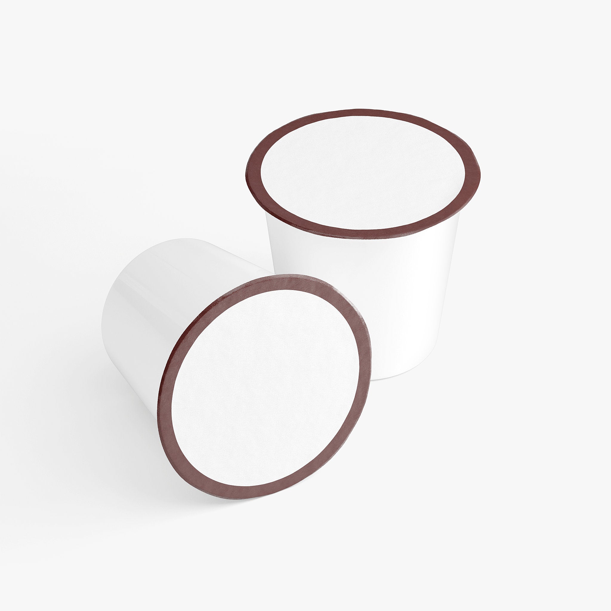 Two cylindrical objects with brown rims For Molten Caramel Coffee Pods (Dark Roast) By Blush And Bloom Care Beauty Store USA