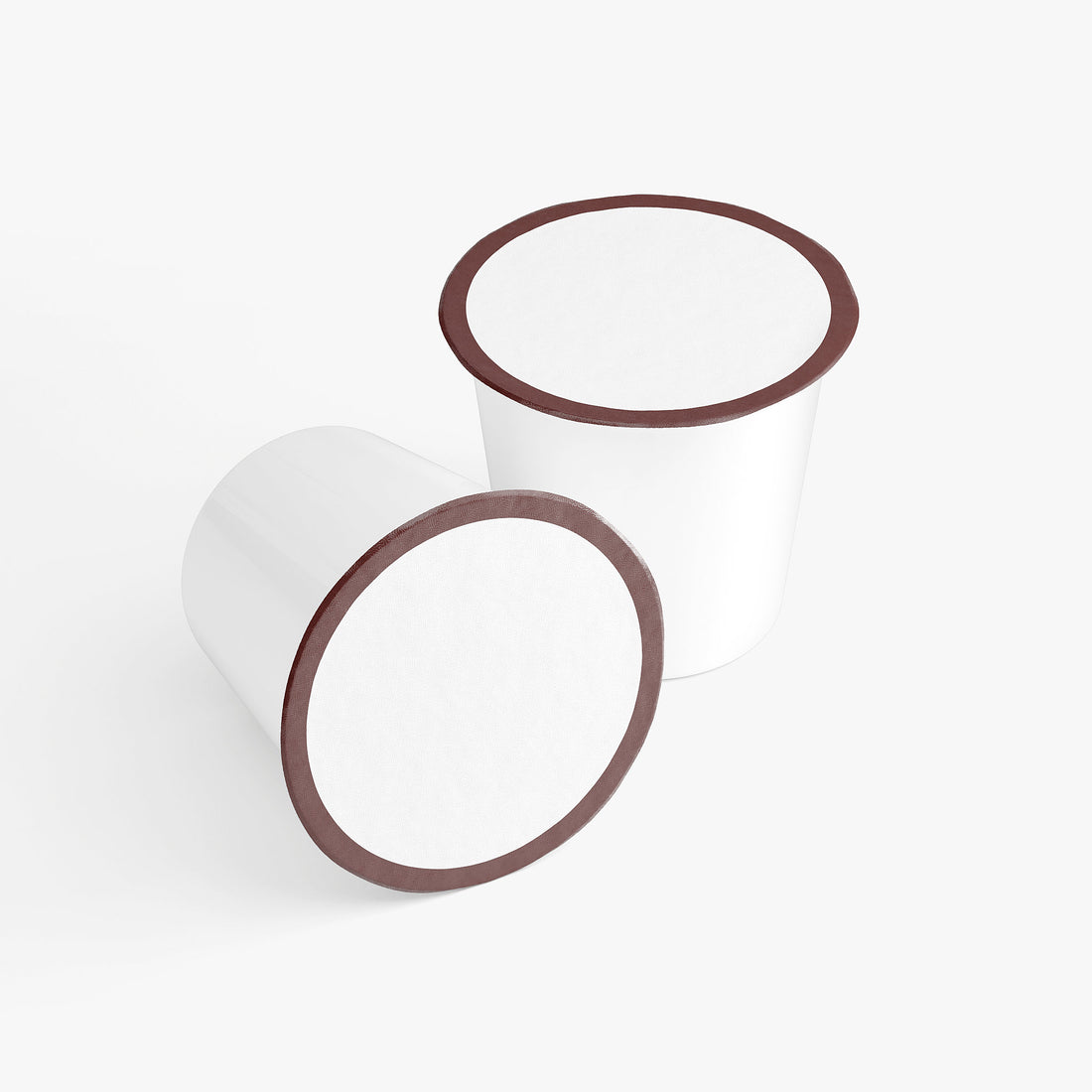 Two cylindrical objects with brown rims For Molten Caramel Coffee Pods (Dark Roast) By Blush And Bloom Care Beauty Store USA